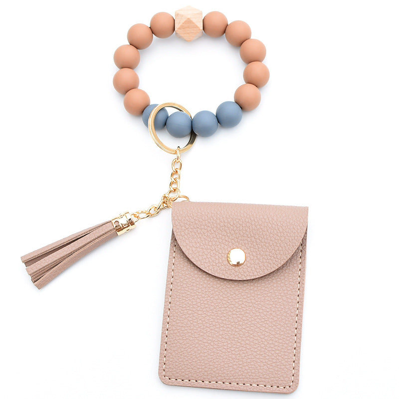 Comercio al por mayor Cuentas de silicona PU Titular de la tarjeta de color sólido Llavero de muñeca